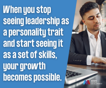 A man in a suit sitting at a table with a laptop, looking down thoughtfully, next to a quote that reads 'When you stop seeing leadership as a personality trait and start seeing it as a set of skills, your growth becomes possible,' with the Mosaic People Development logo.
