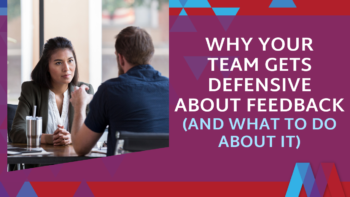 A woman with crossed arms looks warily at a colleague across a table beside the text “Why Your Team Gets Defensive About Feedback (and What to Do About It),” on a red and burgundy geometric background.